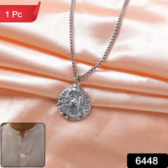 Close-up of silver-tone Hanuman face locket pendant necklace with chain