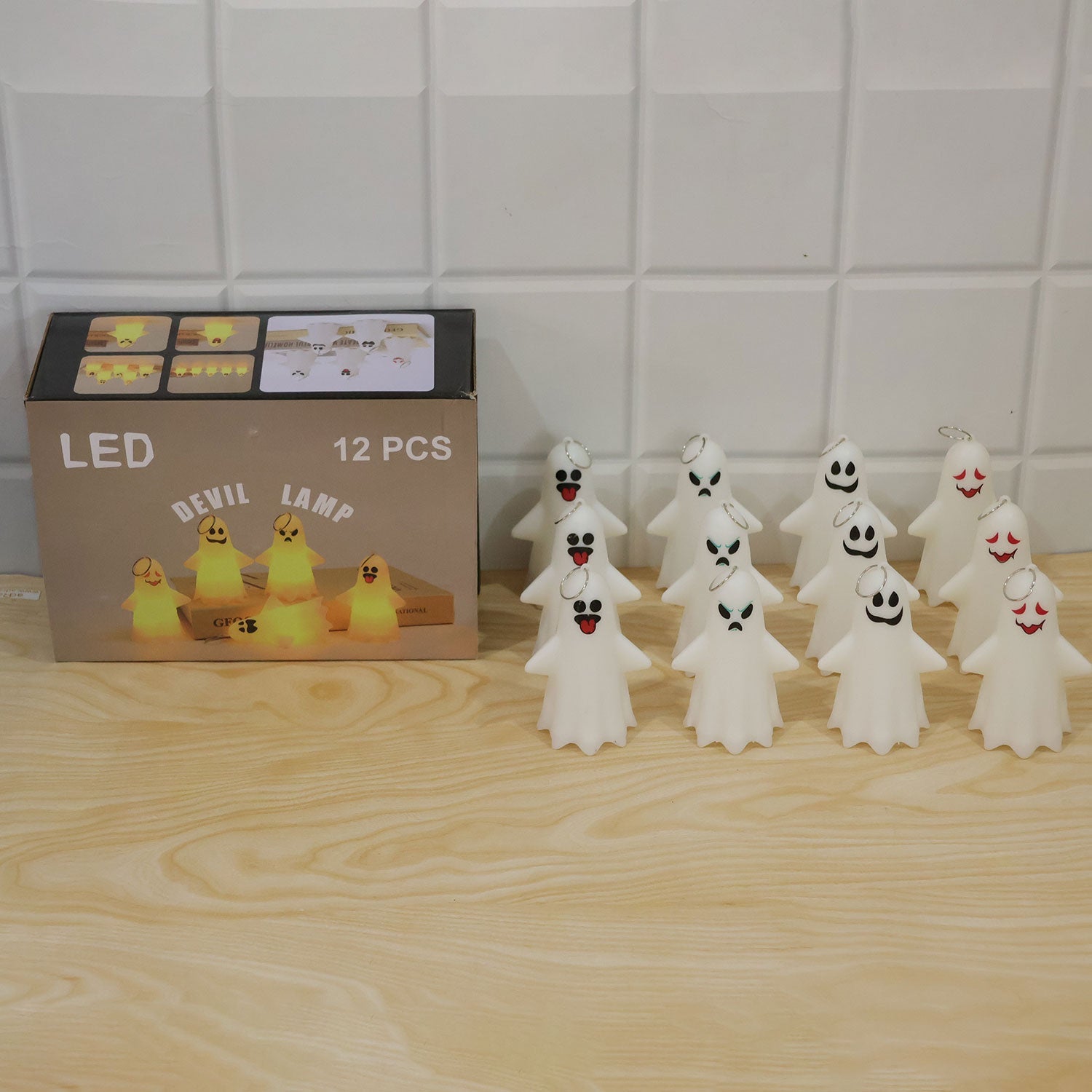 Ghost LED night lights used as festive Halloween decoration on a table