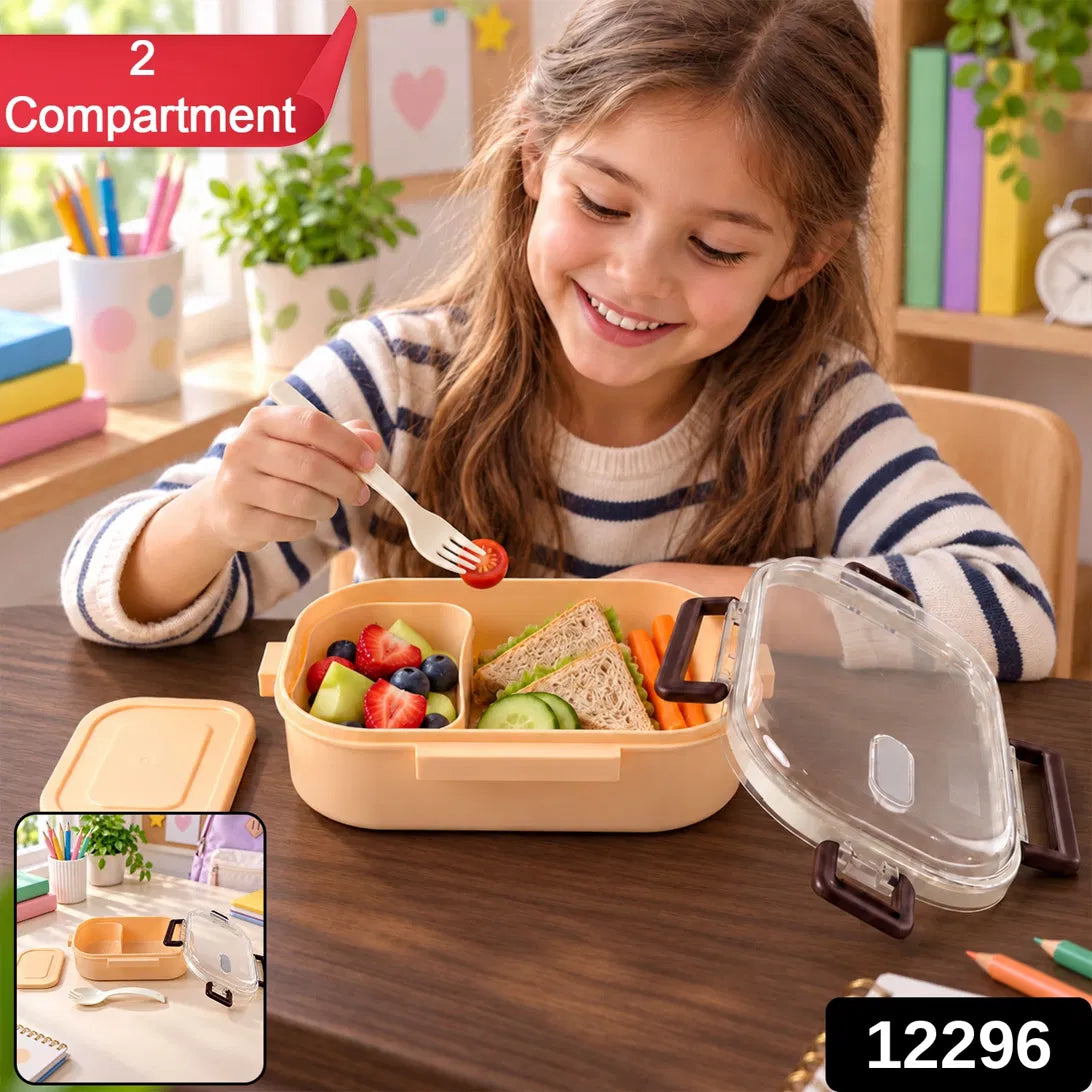A young girl happily eats fruit from a peach lunchbox, which also holds sandwiches and carrot sticks.