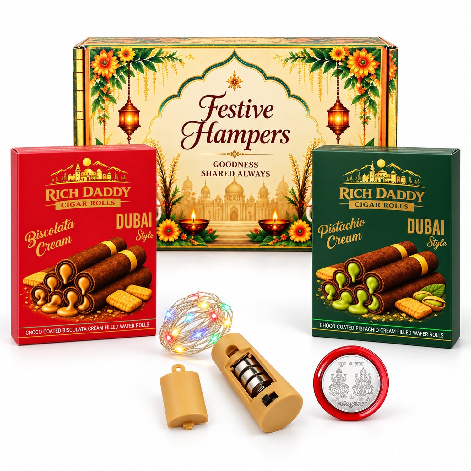 A festive gift box, two wafer roll boxes, fairy lights with a battery pack, and a silver coin are displayed on a white