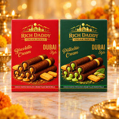 Two boxes of wafer rolls, one red for biscolata cream and one green for pistachio cream, are shown side by side on a marble