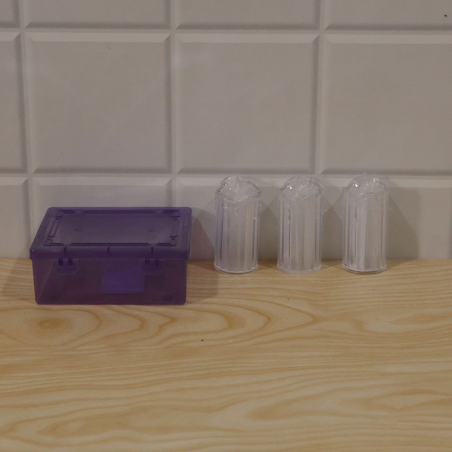 Clear plastic LED flameless pillar candles enhancing a home interior