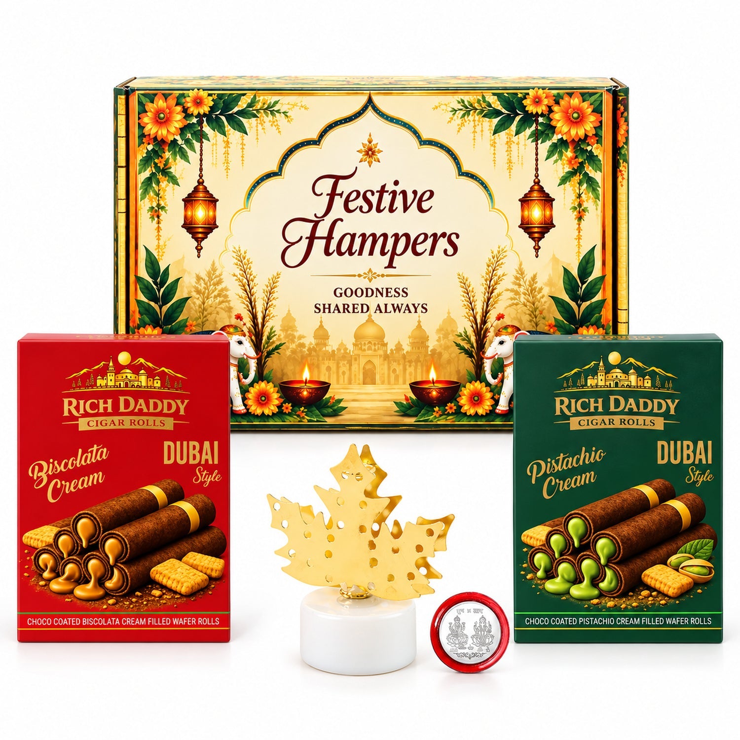 A festive gift hamper with two boxes of wafer rolls, a golden maple leaf lamp, and a silver coin on a white background.