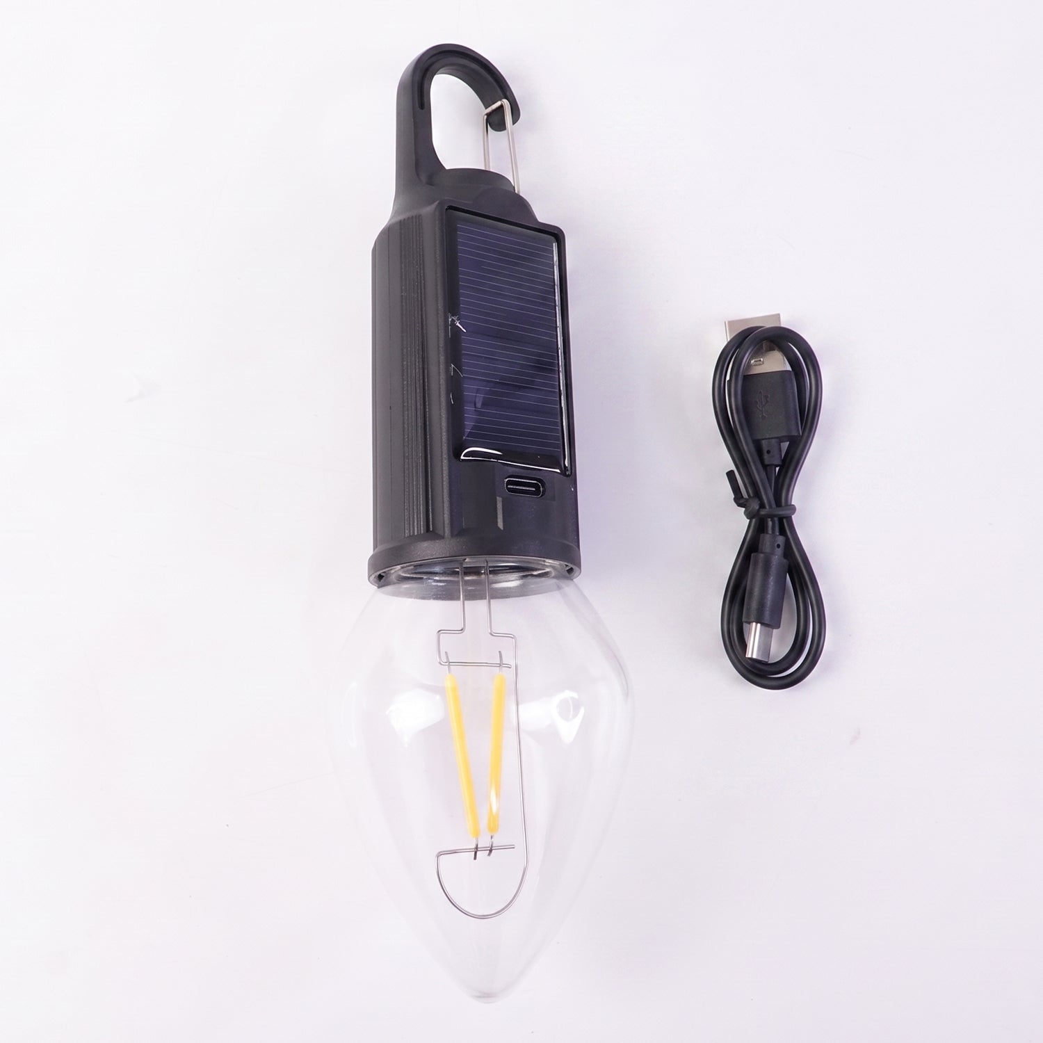 Close-up of vintage warm LED filament bulb in camping lamp