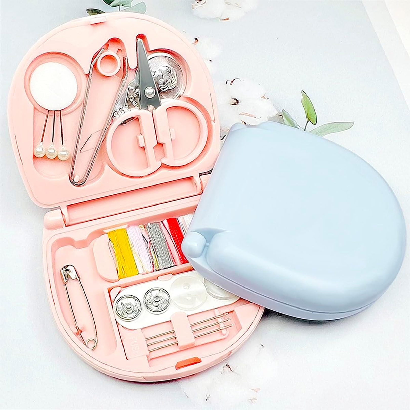 Mini travel sewing kit closed in plastic case