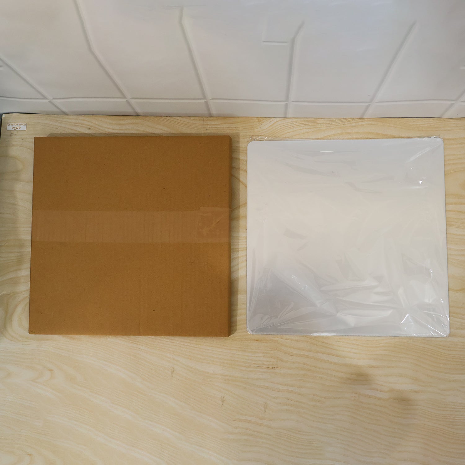 Brown box packaging for the Square flexible mirror sticker