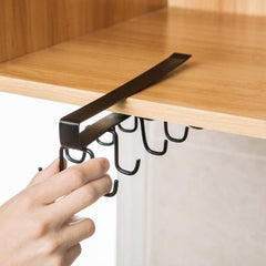 Double-row metal cup holder rack in a modern kitchen