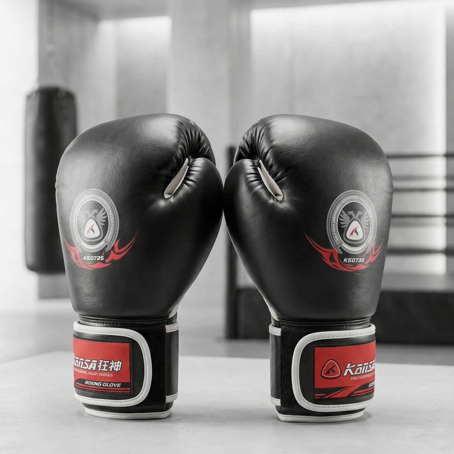 Close-up of padded boxing gloves with adjustable wrist strap for training and sparring.
