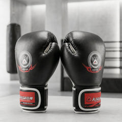 Close-up of padded boxing gloves with adjustable wrist strap for training and sparring.