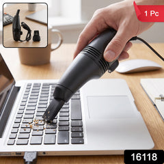 Mini vacuum cleaning a computer keyboard