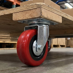 Caster wheel fitted to the base of a trolley