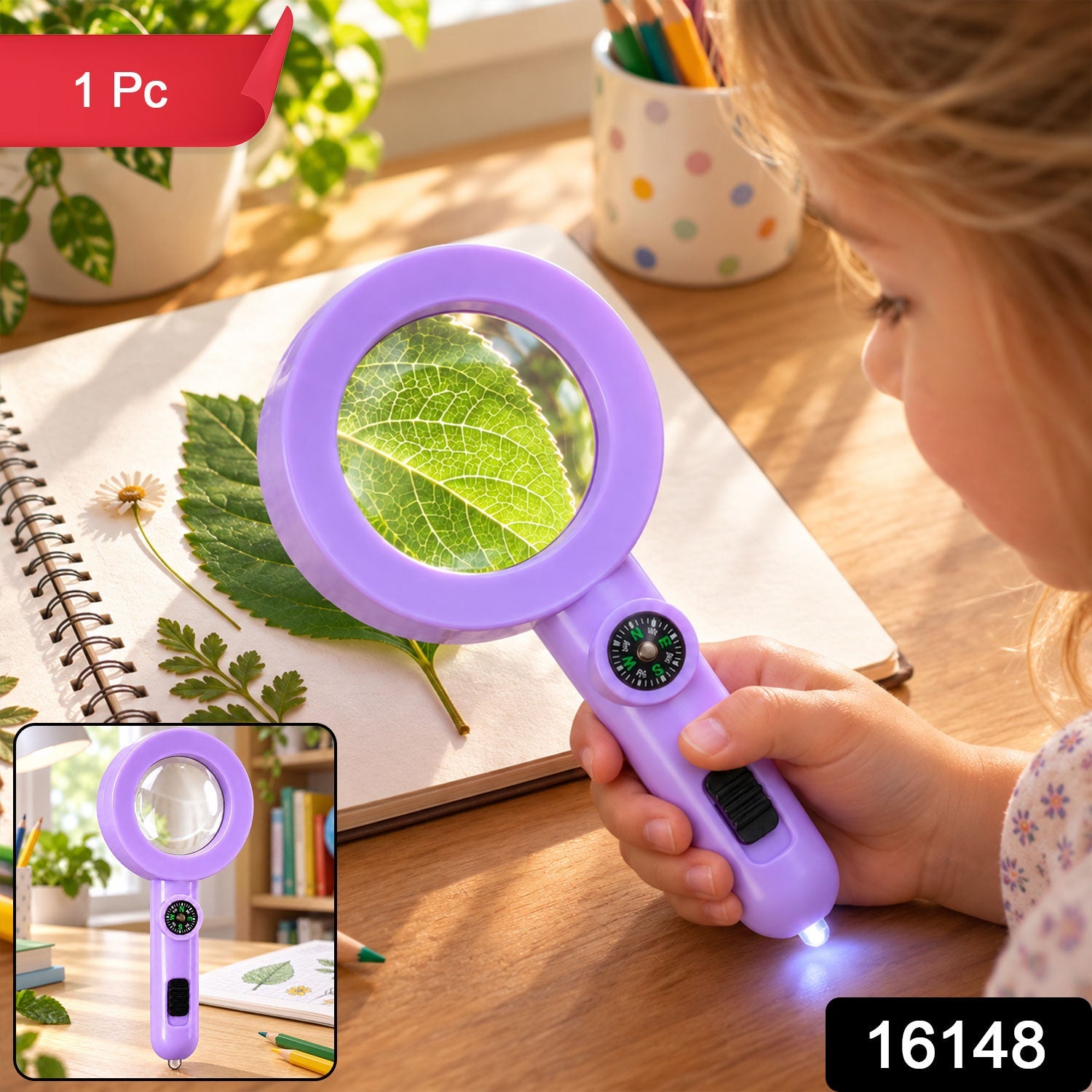 A young child uses a purple magnifying glass with a built-in compass and light to observe a detailed green leaf on a spiral