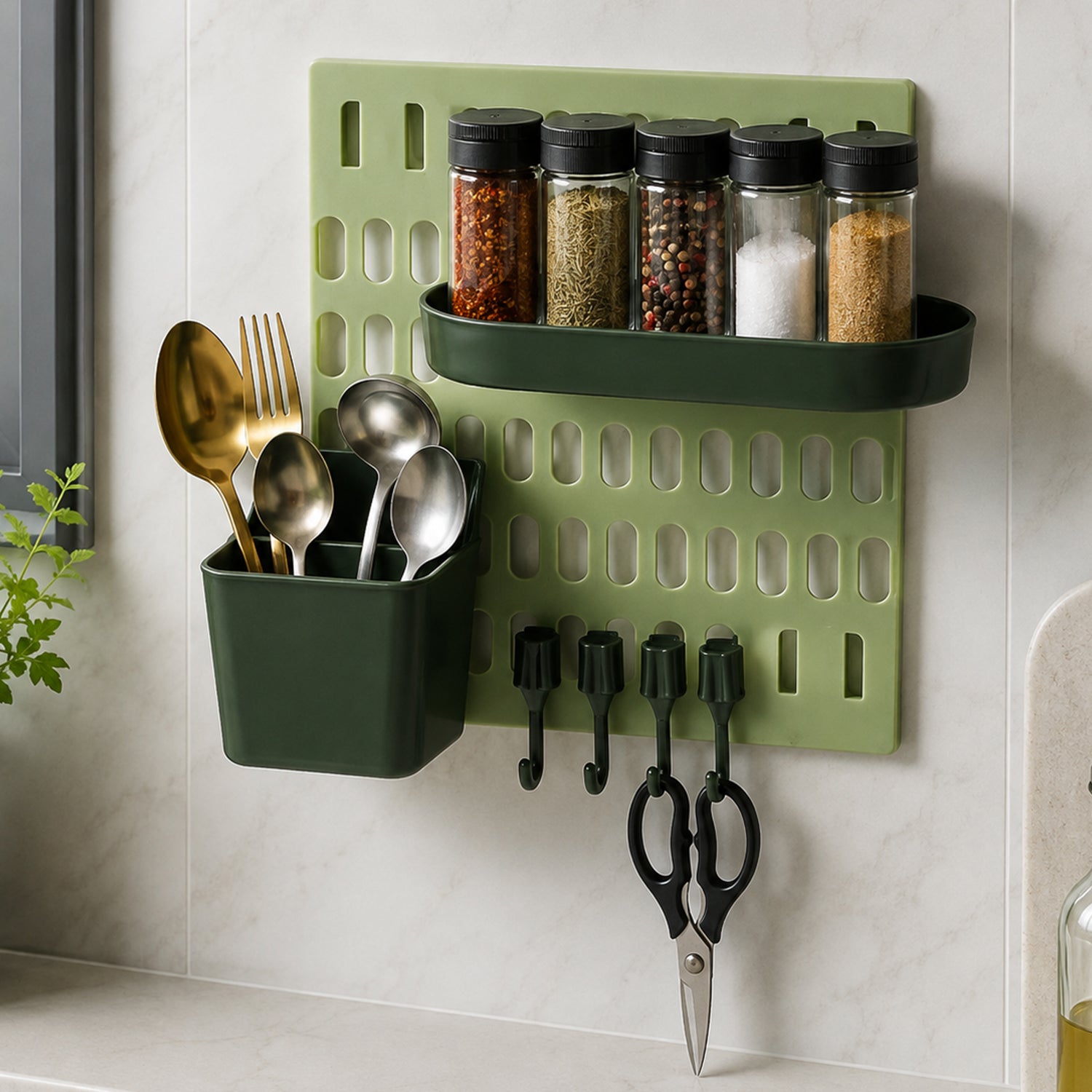 A light green pegboard with a dark green spice rack holding five spice jars, a dark green utensil holder with gold â€“ view 8