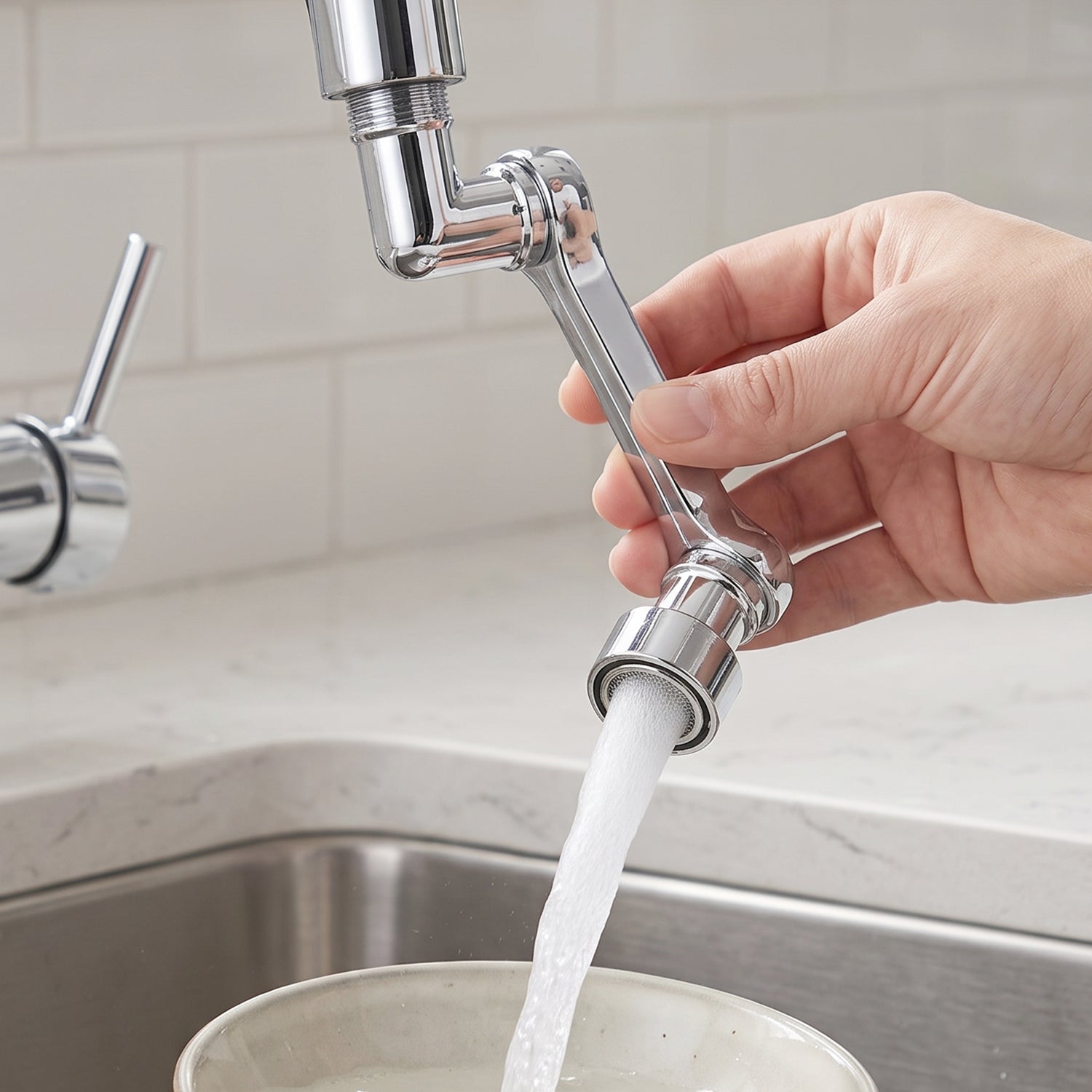 Flexible faucet extender bent over a kitchen sink