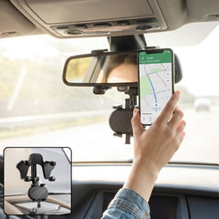 Car rear view mirror phone holder in use