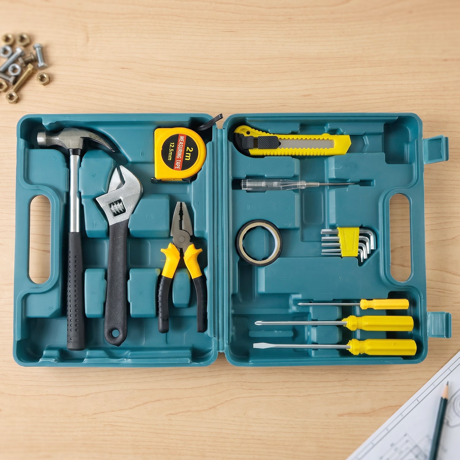An open teal plastic toolbox contains a hammer, adjustable wrench, pliers, tape measure, utility knife, and various