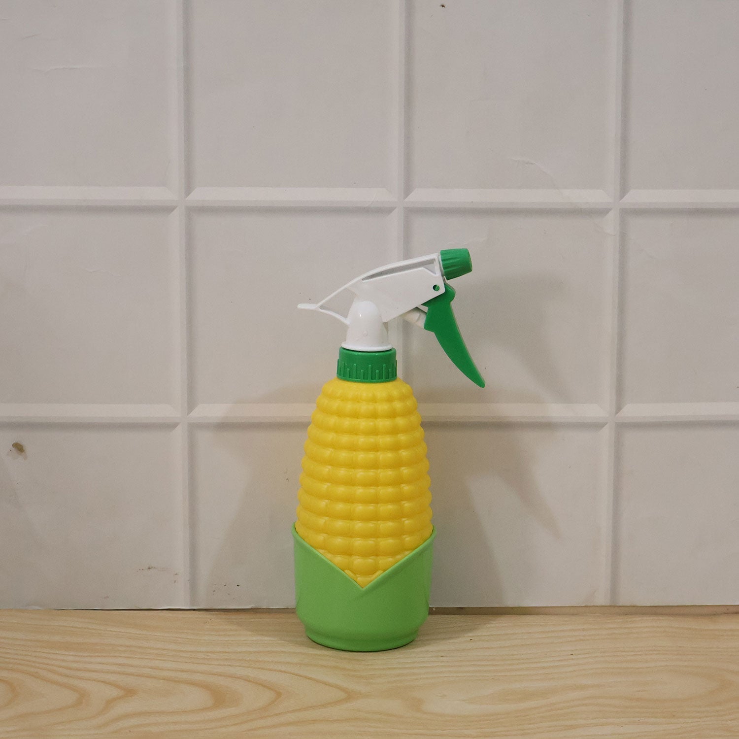 Close-up of the unique corn shape design of the sprayer bottle.