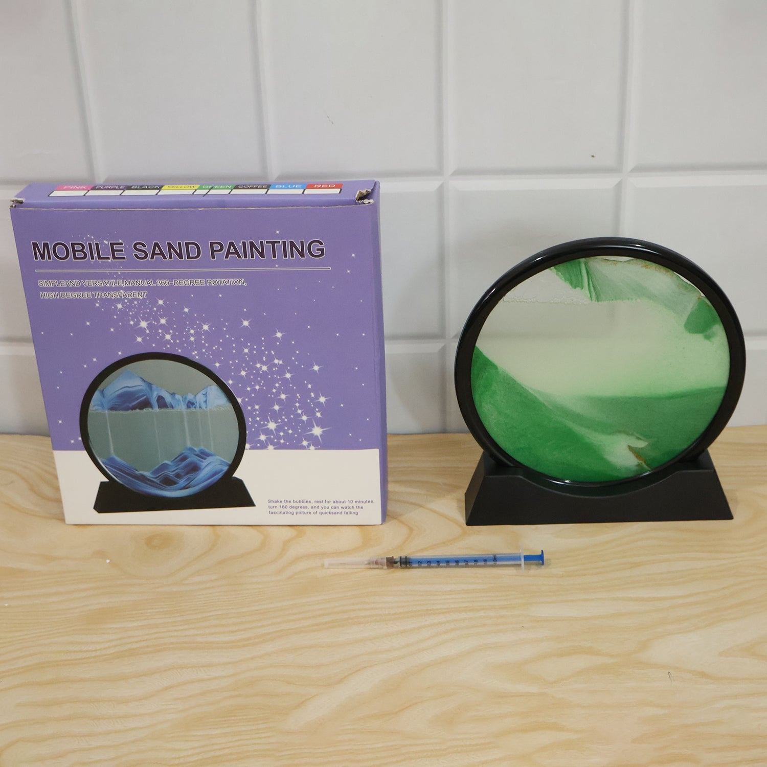 Live photo of 3D moving sand art round frame