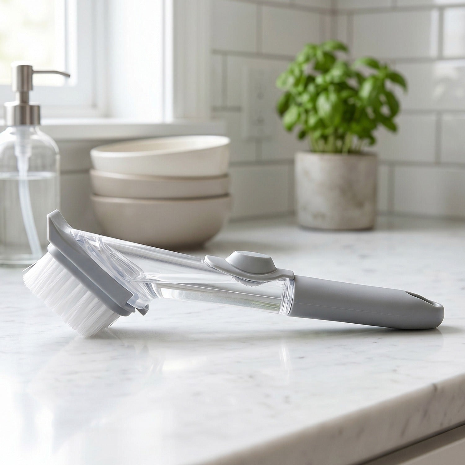 Close-up of the soap dispensing mechanism on the dish scrub brush