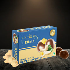 Effete Choco Coated Butterscotch box with cashews and chocolate balls on a dark wooden surface.
