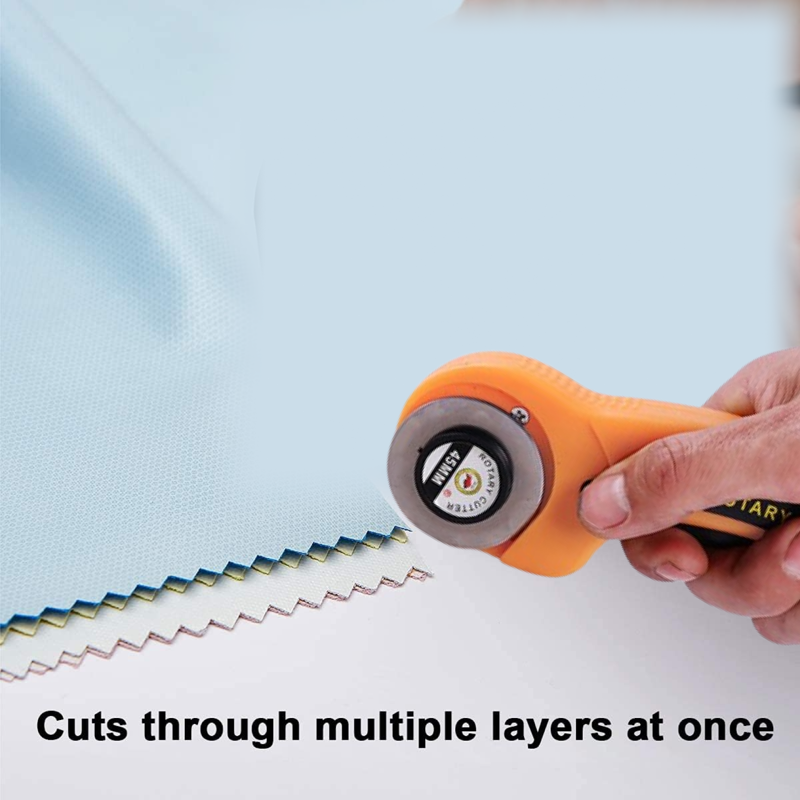 Rotary cutter showing blade and ergonomic grip close-up