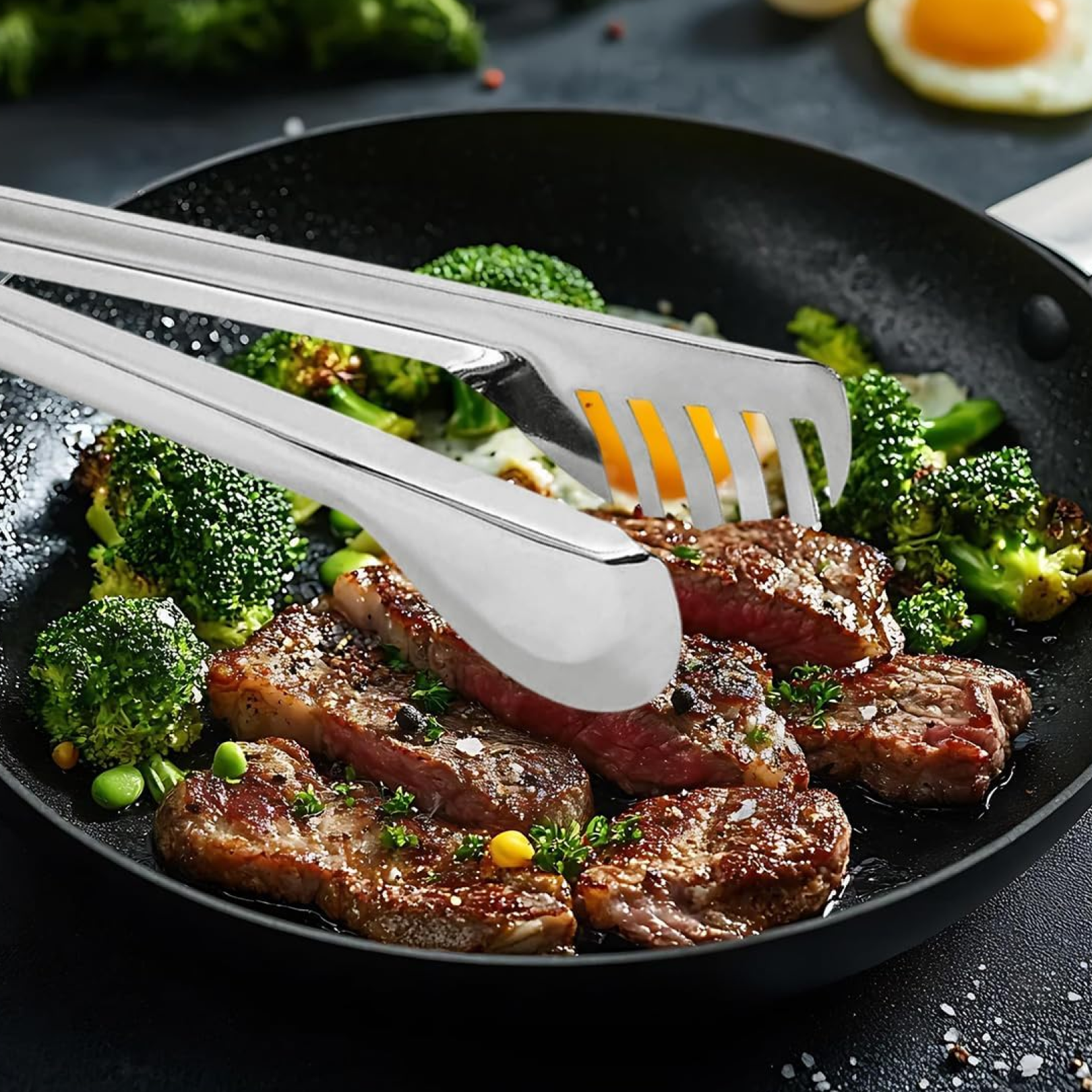 Stainless steel tong serving pasta