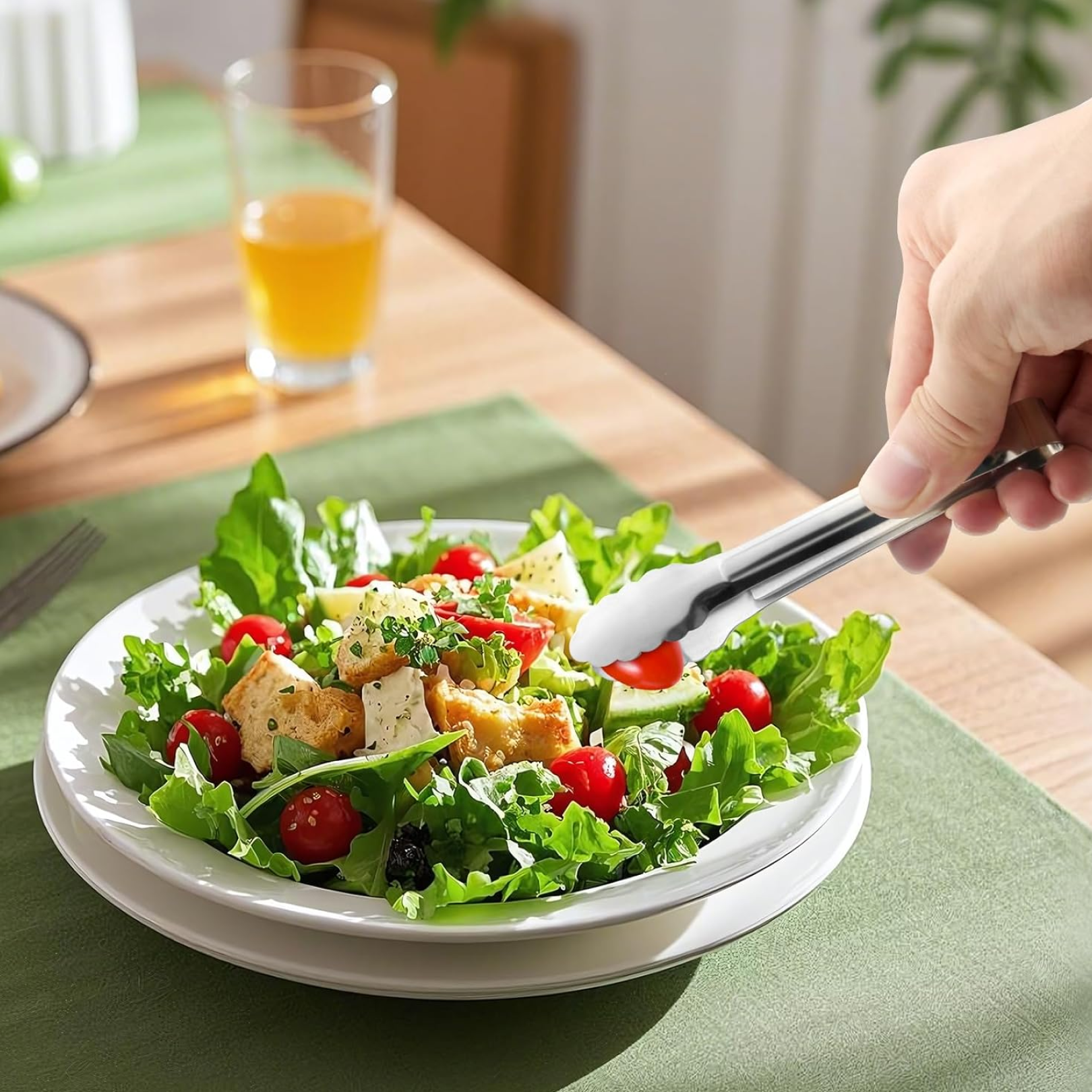 Hand holding ergonomic serving tong