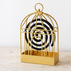 Vintage style mosquito coil holder with intricate metal design