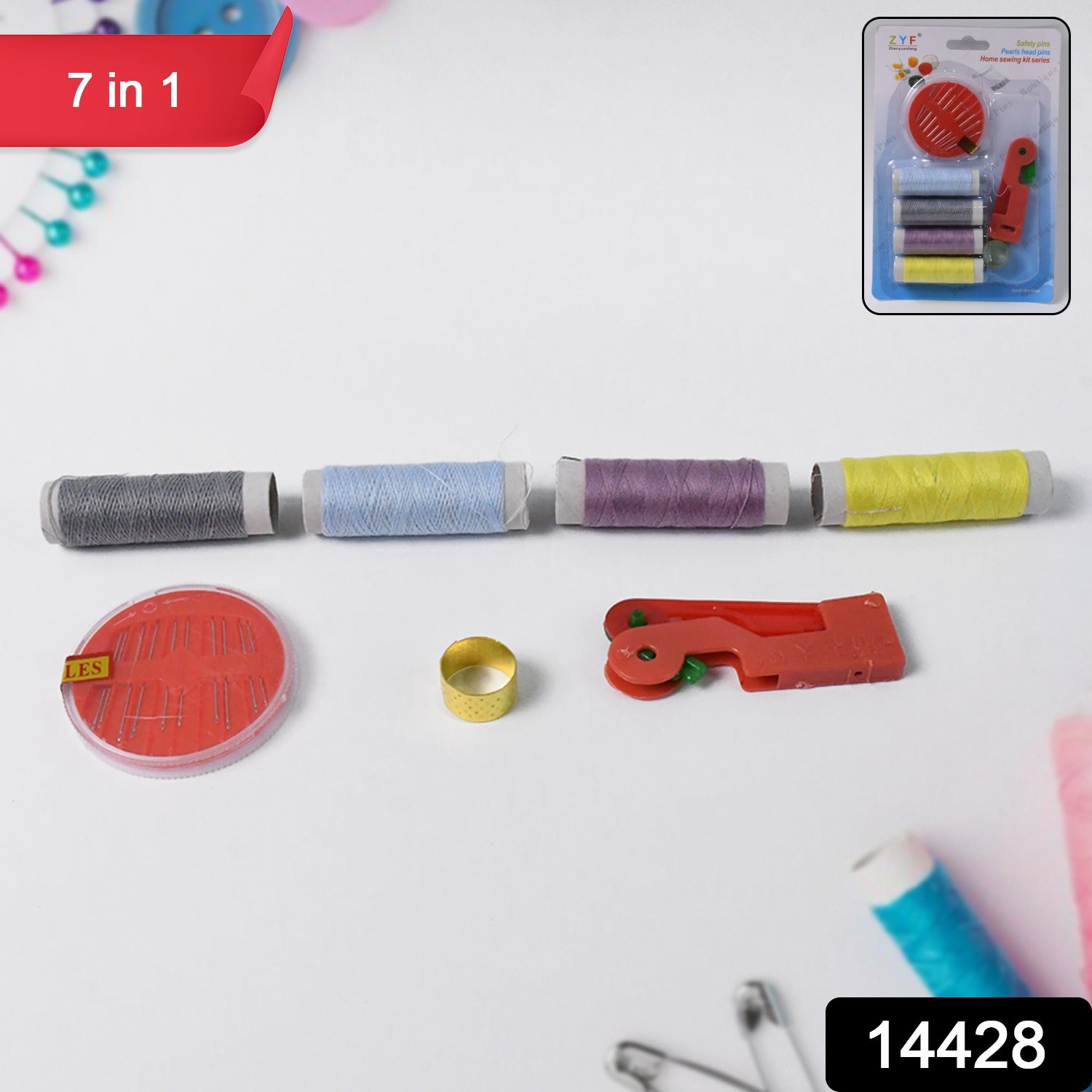 Assorted thread bobbins and sewing tools inside kit