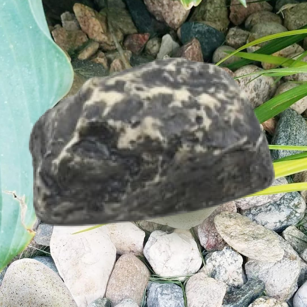 Fake rock key hider open showing key slot