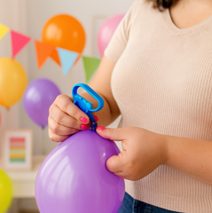 Close-up of balloon tying tool design
