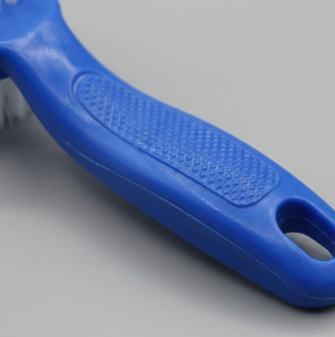 3-piece cleaning brush set on a kitchen surface.