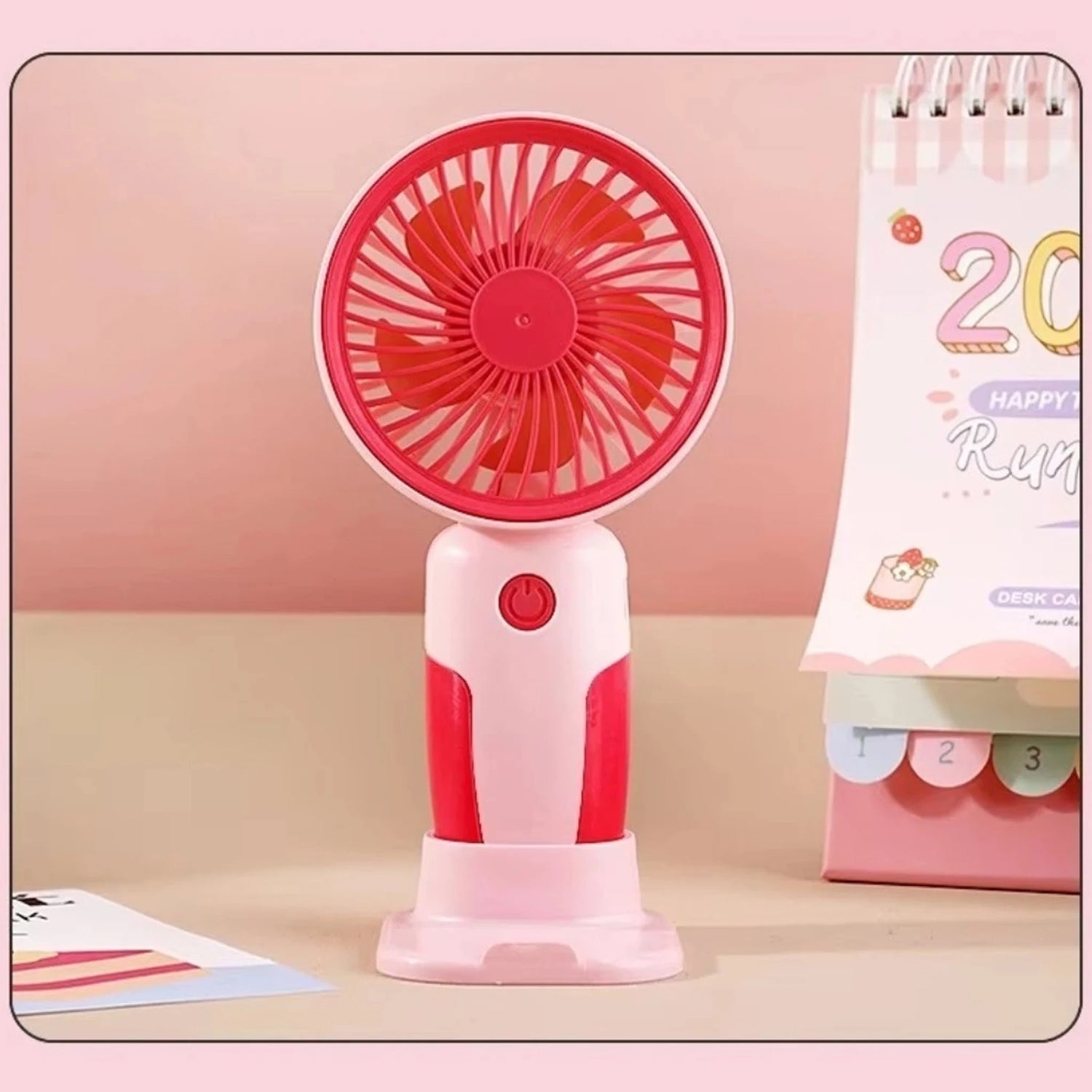 Person holding portable mini fan for daily cooling