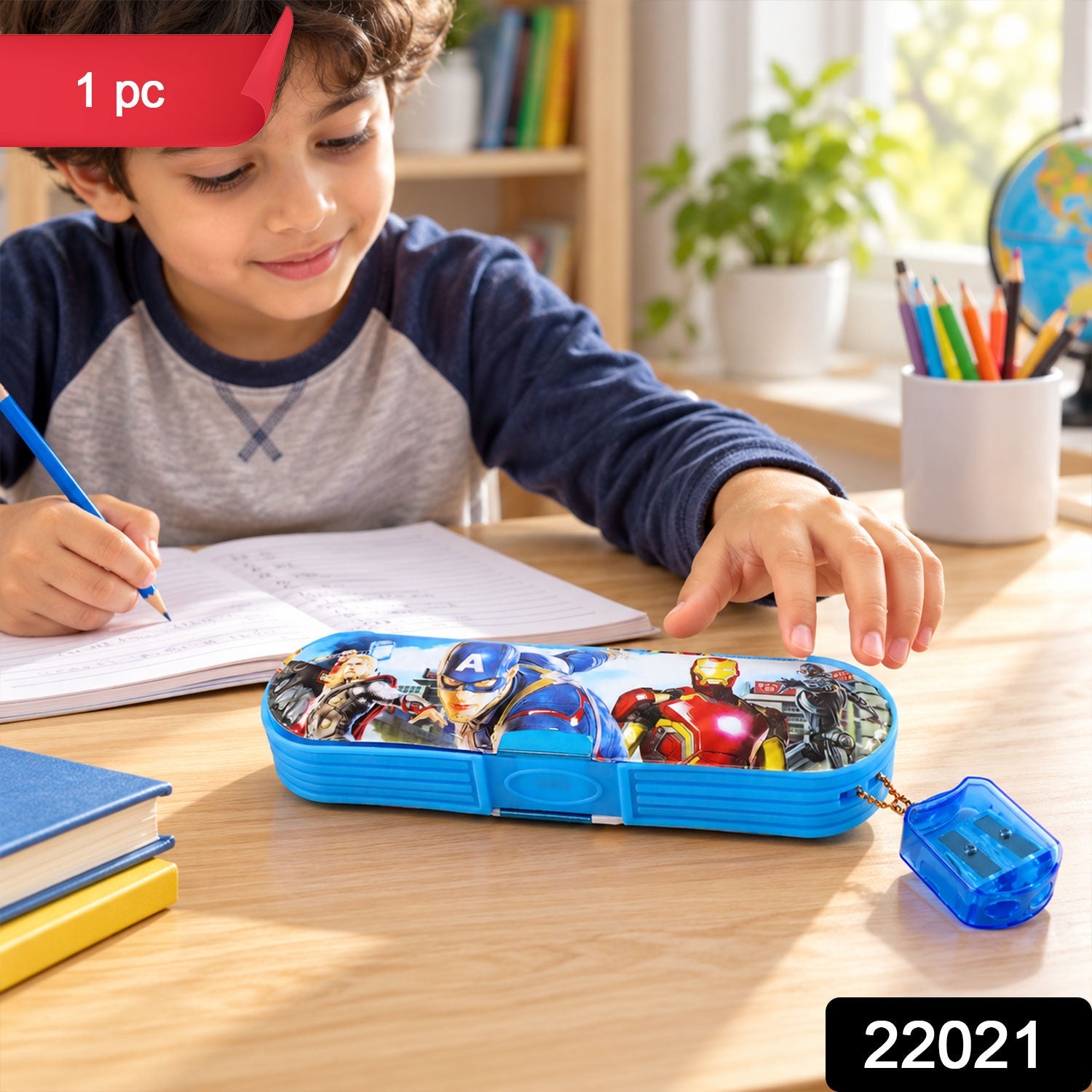 A young boy writing at a desk with an Avengers pencil box and sharpener, with a red "1 pc" sticker.