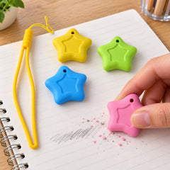 A hand holds a pink star eraser, removing pencil marks from a notebook page, with yellow, green, and blue star erasers