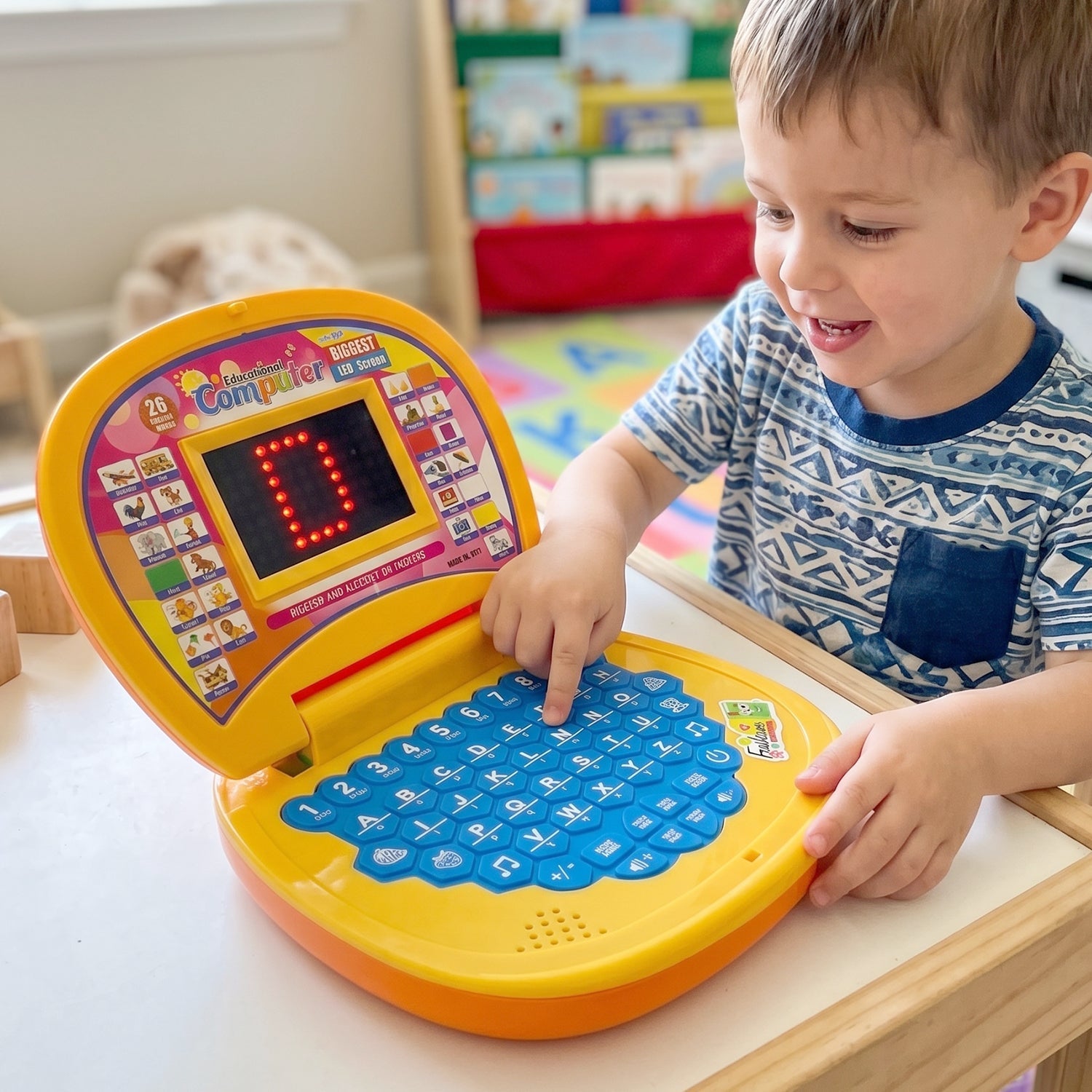 Educational laptop toy in use by child