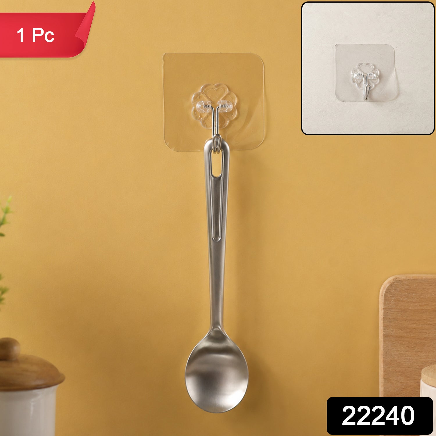 A silver spoon hanging from a transparent self-adhesive hook on a yellow wall, with a close-up inset and '1 Pc' and '22240'