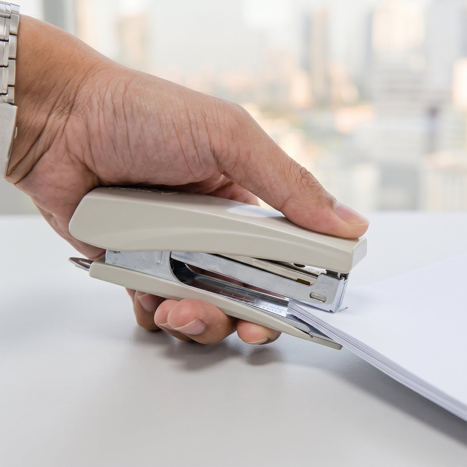 Stapler shown open with staples loaded