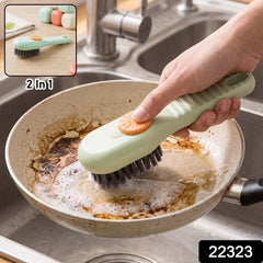 A green and orange liquid-dispensing brush cleans a dirty frying pan in a stainless steel sink, with a small inset showing