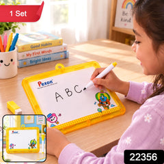 A young girl with dark hair writes â€œABCâ€ on a yellow-framed Pexon writing board with a white marker. A small yellow â€“ view 2