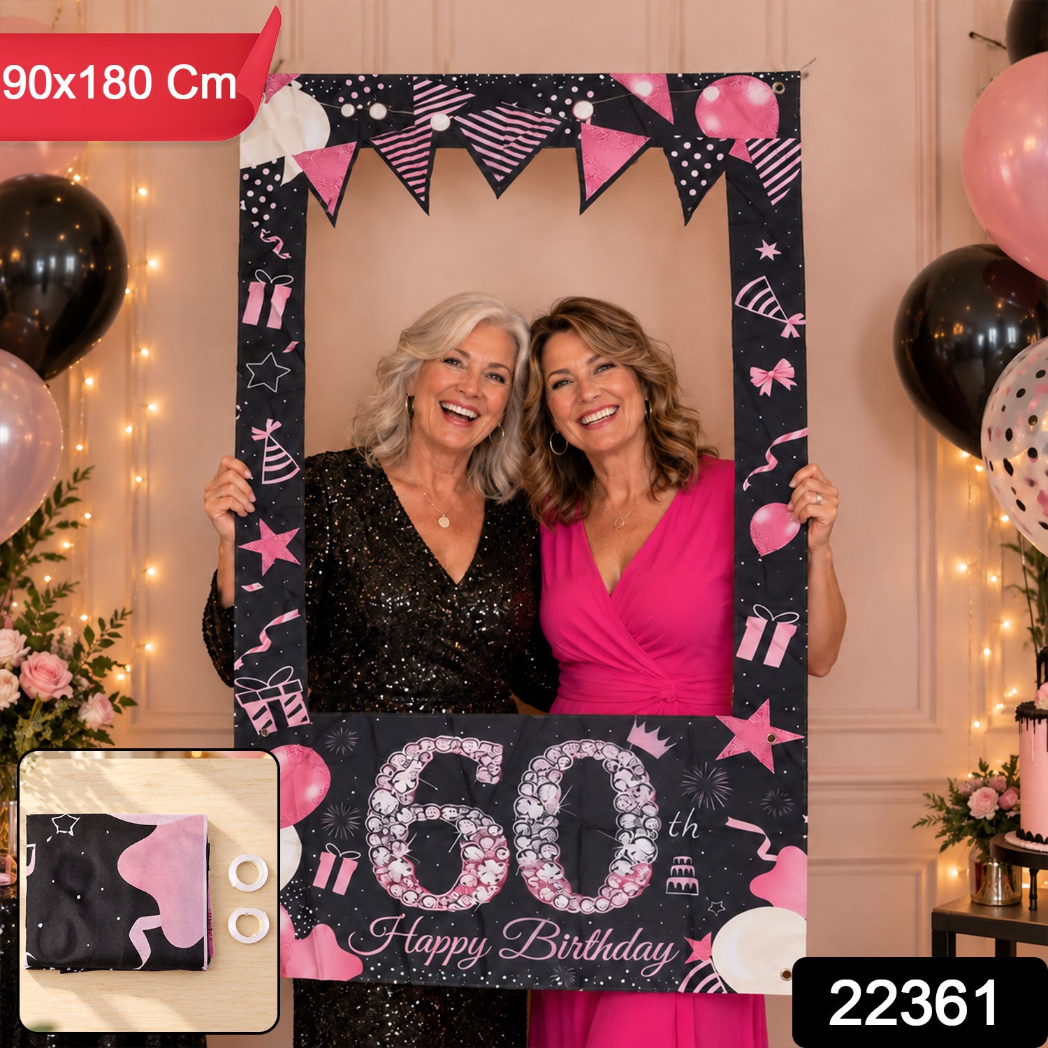 Two smiling women holding a black and pink 60th birthday photo booth frame; a small inset shows the folded banner and