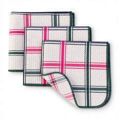 Three plaid dishcloths, each with distinct color accents of pink, green, and blue, are fanned out.
