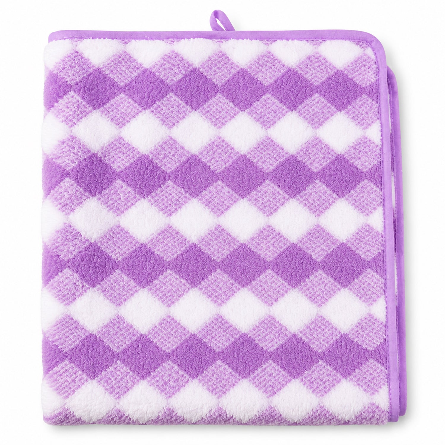 A close-up, top-down view of the purple and white checkered microfiber towel, neatly folded.