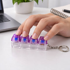 A hand presses down on the four purple and clear keyboard switches of a keychain on a white desk.