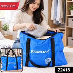A woman puts a blanket into a blue JOGENMAX storage bag with black handles, with a small inset showing the bag full.