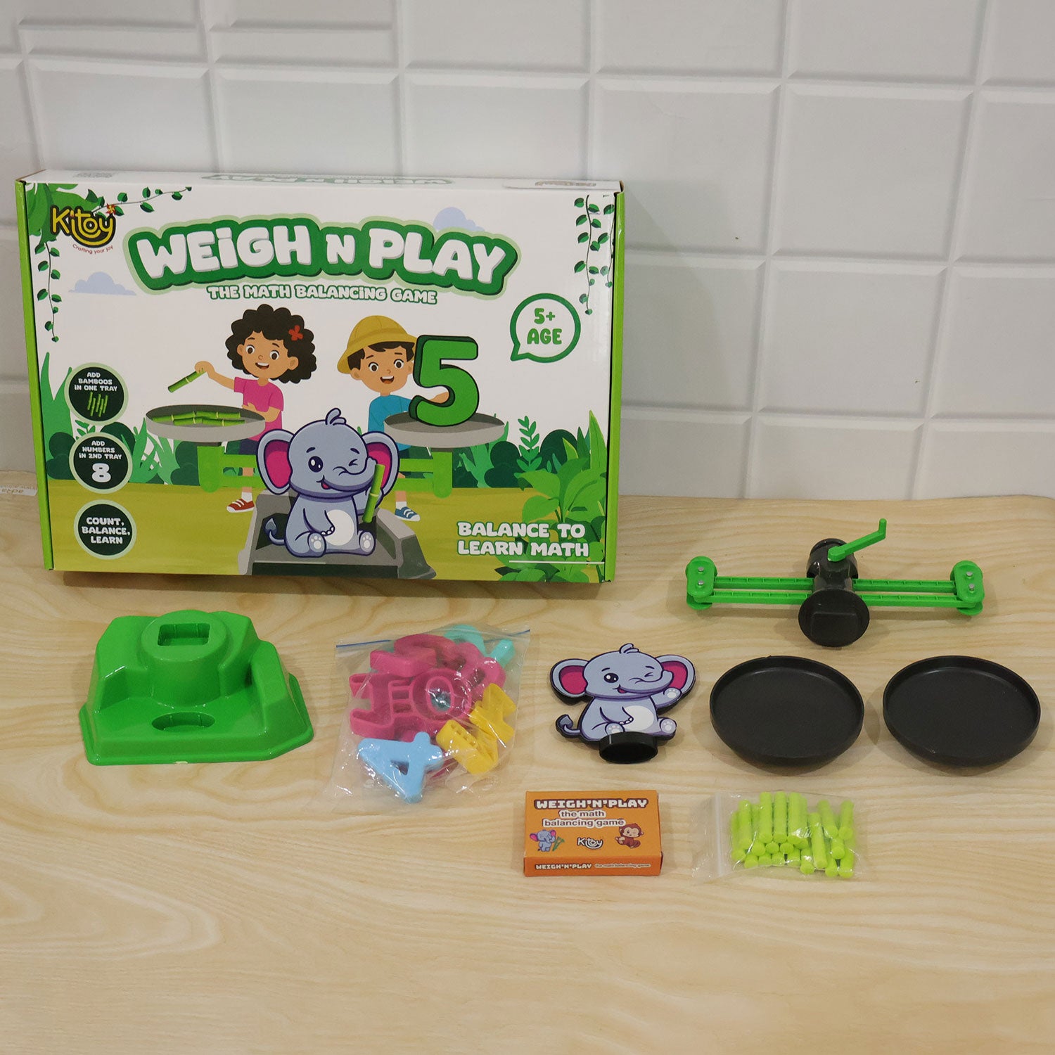 Child engaged with elephant math balancing game for learning