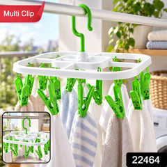 White square drying rack with green clips holding small towels, with an inset image of the rack.