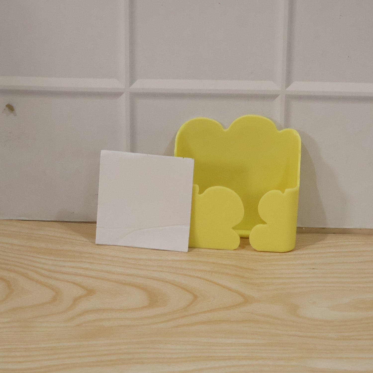 The product box for the wall mount phone holder, highlighting key features.