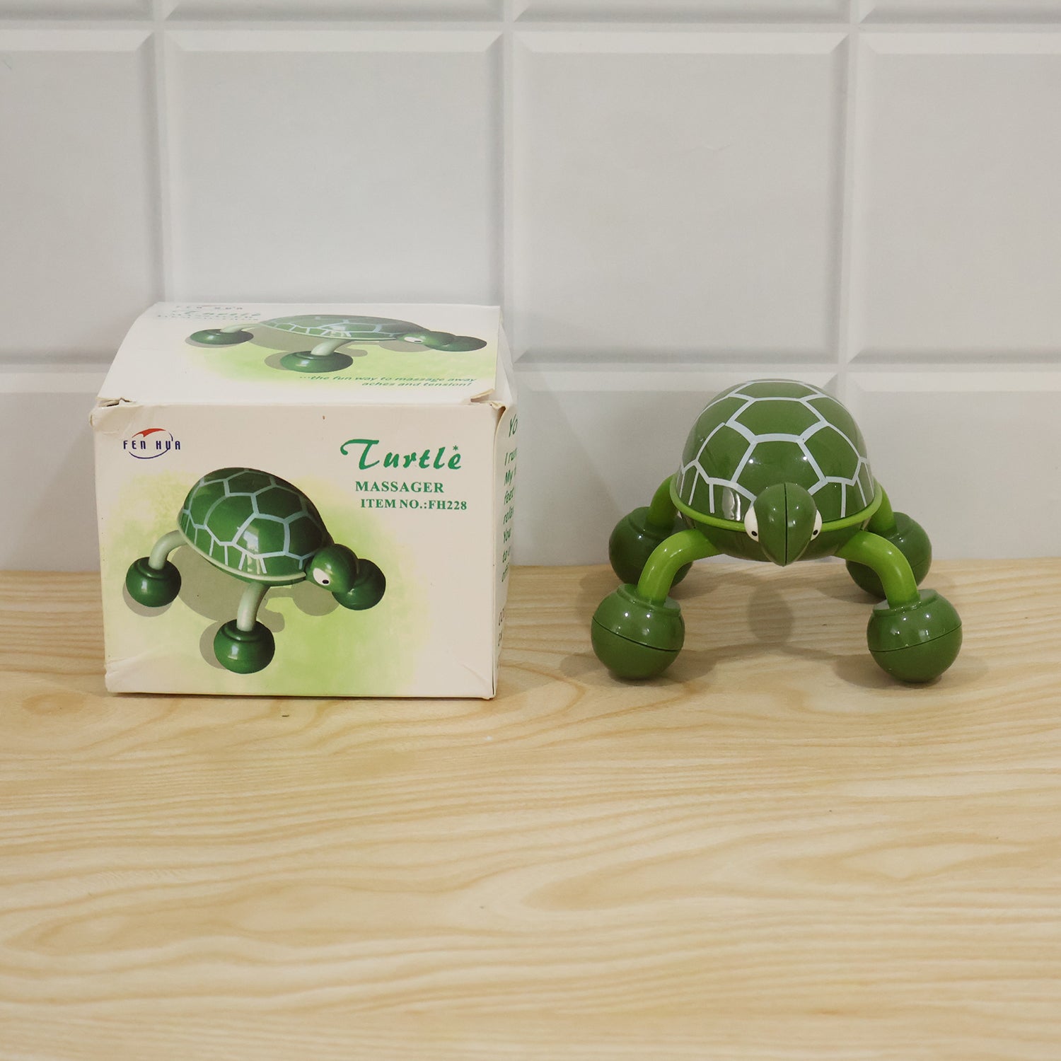 Authentic photo of the green plastic turtle shape body massager