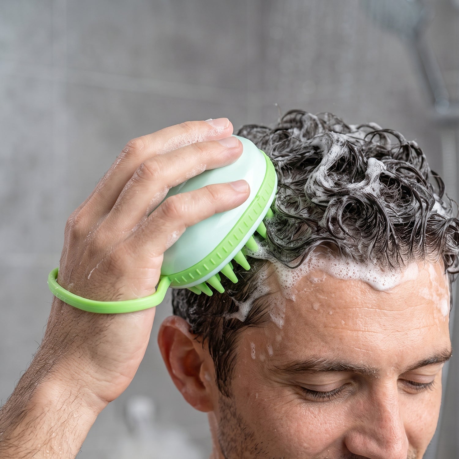 Scalp massager brush used while shampooing hair